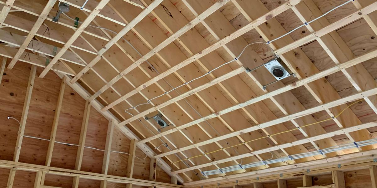 New ceiling and roof framing and electric wiring installed